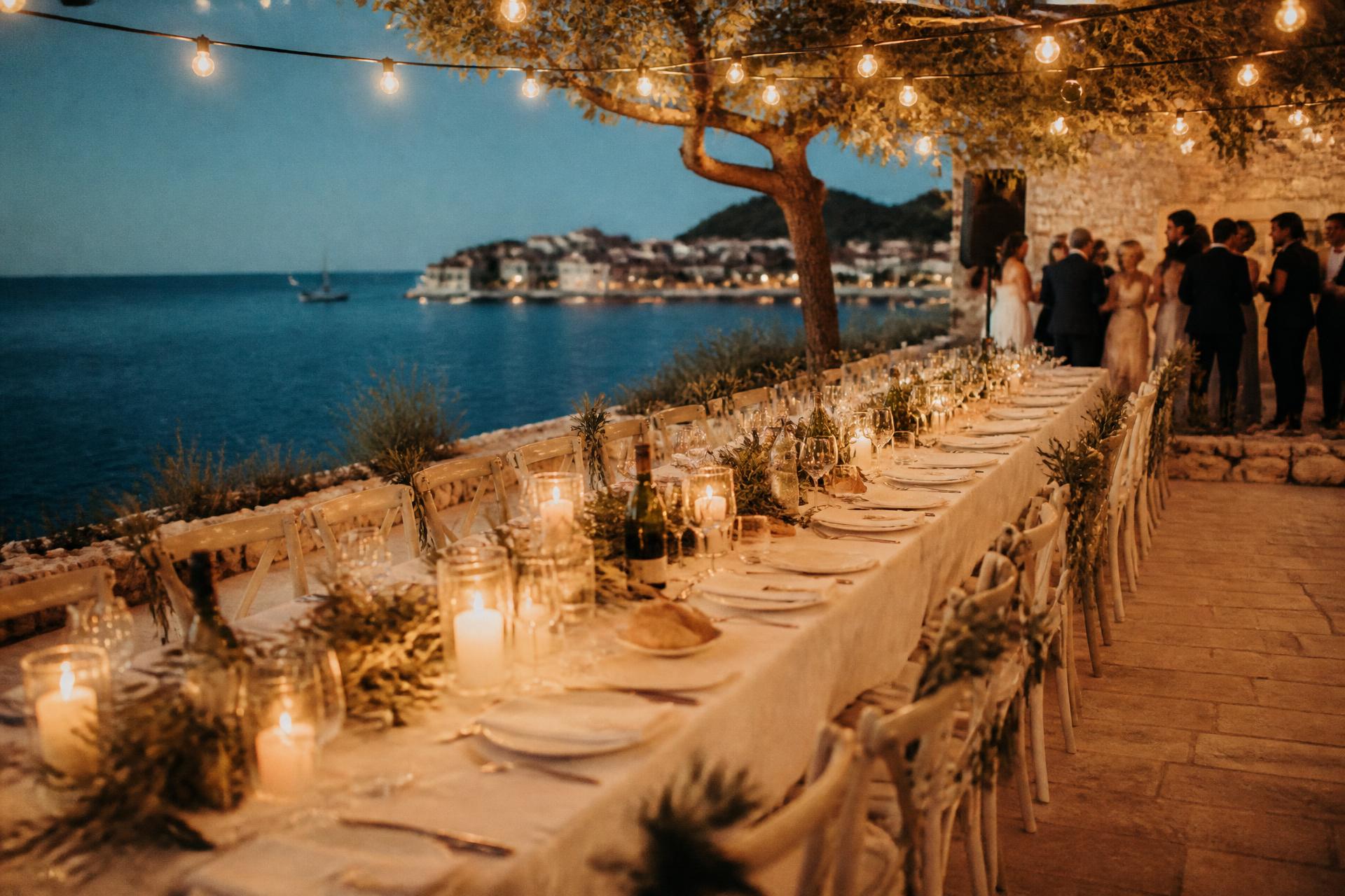 Seaside dinner table at dusk on a Croatian island